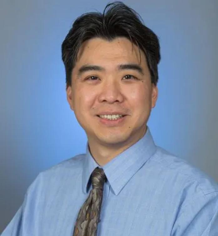 A photo of Raymond Wang, MD.